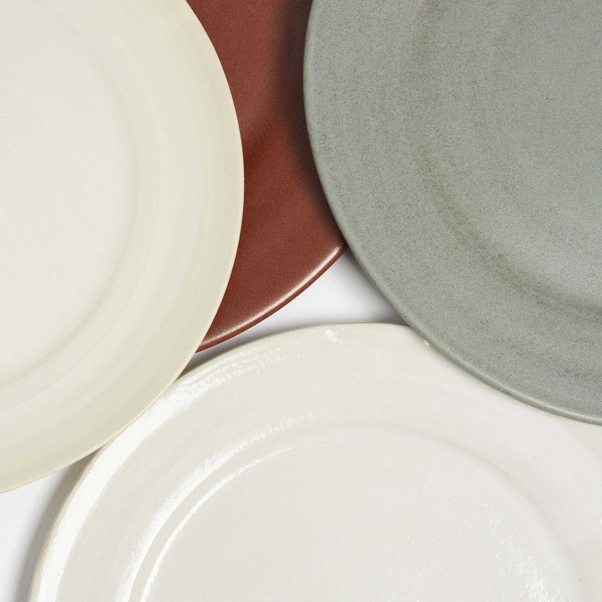 Set of 4 Off-White Matte Glaze Wheel-thrown Dinner Plates - Arielle De Gasquet Group Plates Close Up The Garnered