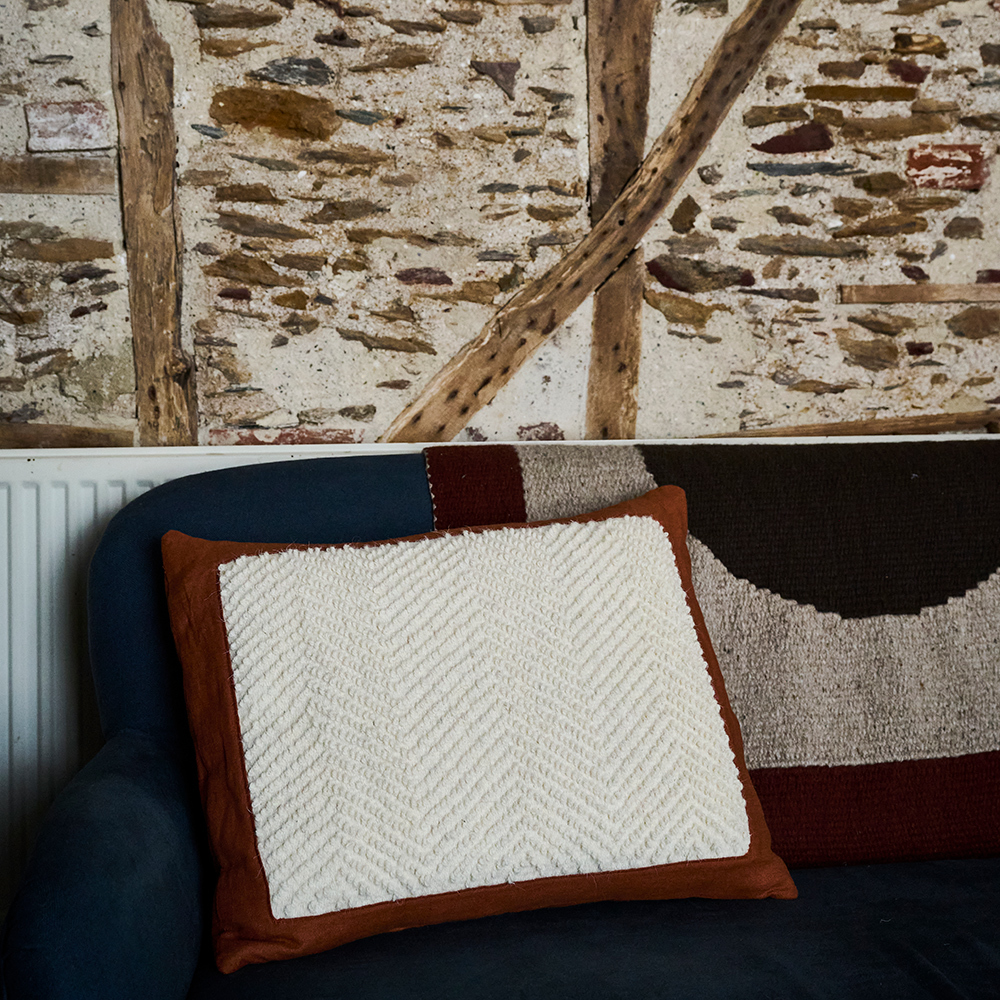 Hand-Woven Hilda Cushion – Terracotta - The Garnered Nancy Nicholson Studio Hilda Tapestry Bolster Styled 1